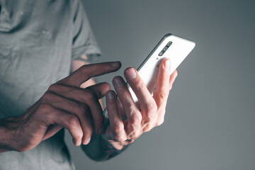 a man holding a phone in his hands