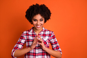 Photo of cheerful pretty lady touch arms fingers brainstorming isolated on orange color background