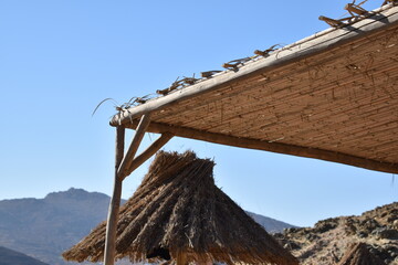 Flat and cone shaped shelter windy beach