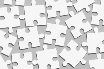 White puzzles in a chaotic order on a gray background