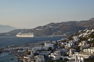 ship hugging harbor port city