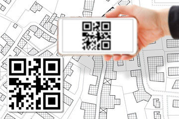 Imaginary cadastral map of territory with buildings and land parcel - land and property registry and real estate property concept with smart phone and totally invented QR code