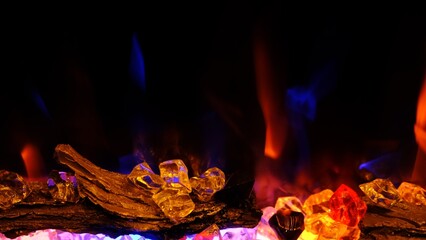 view on electric fireplace with artificial sparkling flame, decor for the interior, blue and orange flame