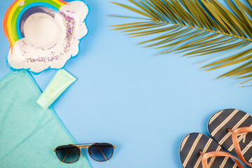 beach accessories with pastel colored background, summer arrives