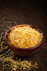Straw potatoes in a bowl on the table.