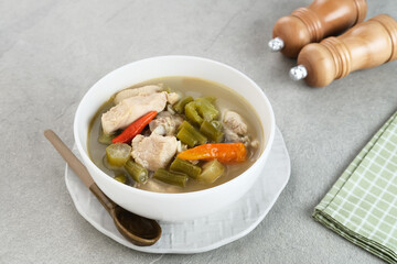 Asem-Asem Ayam or Garang Asem Ayam, Indonesian traditional food, processed chicken dishes with sour and spicy flavors. 
