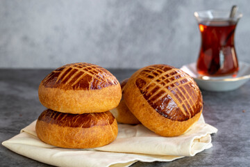Pogaca. Turkish pastry product. Pogaca on dark background. Close-up.