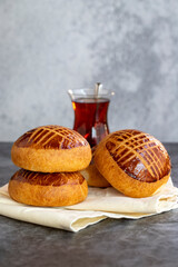 Pogaca. Turkish pastry product. Pogaca on dark background. Close-up.