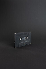 Audio cassette close up, isolated on dark grey background. Analog Audio Tape. Audio K7 Tape...
