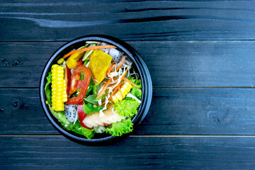 Fresh salad with chicken, tomatoes and mixed greens,corn salad, (arugula, mesclun, mache) Home made food.