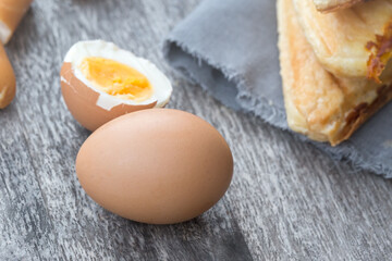 Eggs and Sandwich placed on wooden boards. This can be used as a business card background and can be used as an advertising image.