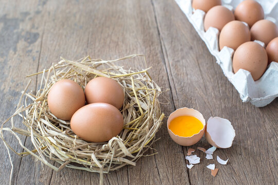 eggs and egg yolk on wooden background.  This can be used as a business card background and can be used as an advertising image.