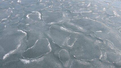 Aerial view of floating ice floes in the sea, the onset of spring, the concept of global warming