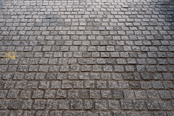 Old stone road or path way in a perspective. Cobble pavement in an old town.