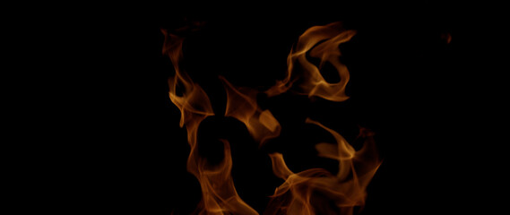 Fire Flames Igniting And Burning, Fiery orange glowing. Abstract background on the theme of fire. Real flames ignite. Royalty high-quality free stock image of  flames isolated on black background