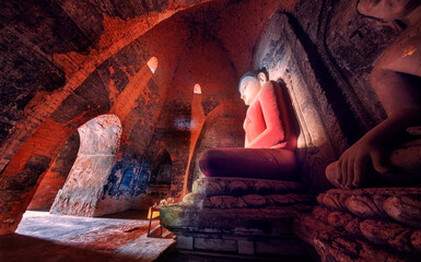 Ancient sitting Bagan Buddha in traditional Bagan style. Bagan is the new UNESCO or World heritage site. - obrazy, fototapety, plakaty
