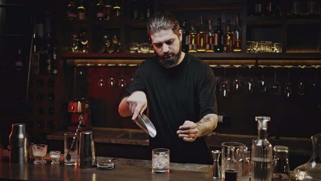 Process of preparing cocktail by professional bartender