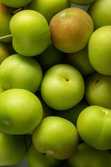 Full screen Stacked Fresh Green Plum (Japanese apricot) background