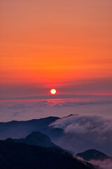 Scenic view of mountains against sky during sunrise