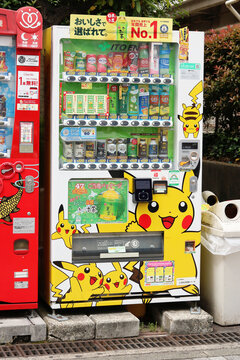 TOKYO, JAPAN - May 8, 2022: A pair of drinks vending machine on a street in Tokyo's Koto Ward. One of the machines has a Pikachu Pokemon livery and includes limited edition Ito En green tea.