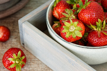 Red strawberry organic fruits in a bowl. Fresh berries fruit snack.