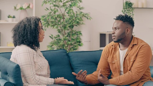 Stressed African American couple having argument at home, relationship crisis