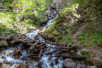 Waterfall with wooden bridge in the forest