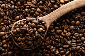 Coffee beans and wooden scoop