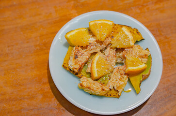 Grilled Tempeh and Roasted Pumpkin Salad Garnished with Orange and Sesame Vegan Soft Focus
