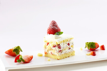 Fresh delicious strawberry cake on white background