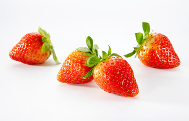 Closeup of fresh strawberries on white background