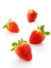 Closeup of fresh strawberries on white background