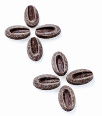 Black chocolate granules, on a white background