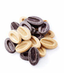Black and white chocolate particles, on a white background