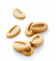 White chocolate granules, on a white background