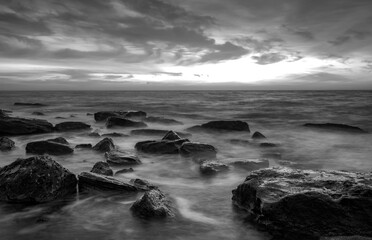 Fototapeta premium Stunning black and white long exposure seascape at cloudy day.