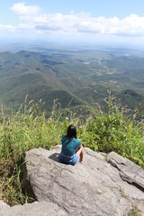 person on the top of a mountain