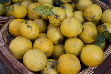 : Lemons.
A basket with yellow lemons.