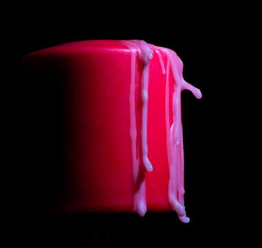 Wax frozen on the side of a red candle