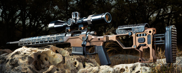Hunting rifle with riflescope outdoors
