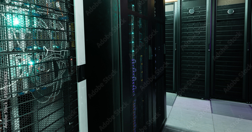 Poster image of empty corridor with rows of computer servers with green and purple lights