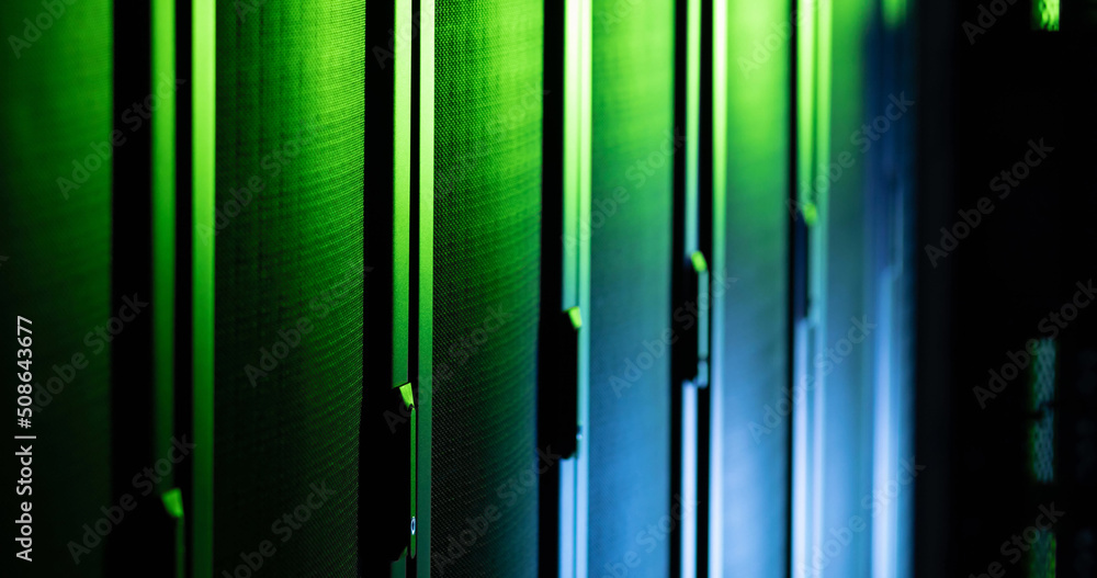 Poster image of close up of empty corridor with row of blue and green computer servers
