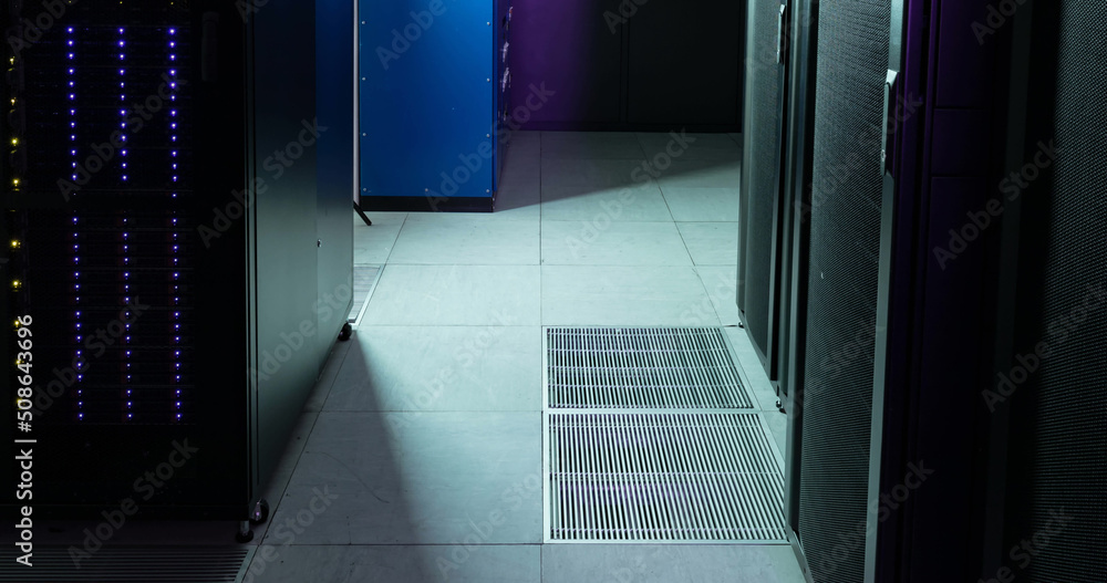 Poster image of empty corridor with rows of purple and blue computer servers