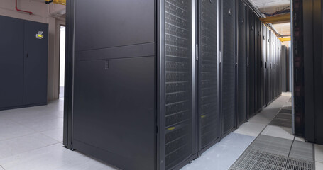 Image of empty corridor with rows of computer servers