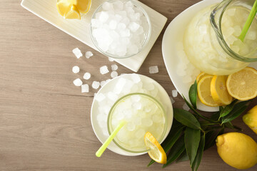 Lemon drink with lots of ice on table top view