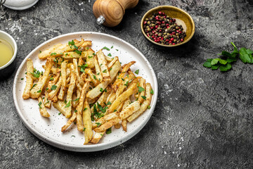 Healthy Homemade food, roasted parsnips side dish on plate. Delicious vegetarian breakfast or snack, Clean eating, dieting, vegan food concept. top view