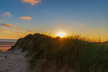 sunset over the sand dunes at Formby beach, England, UK