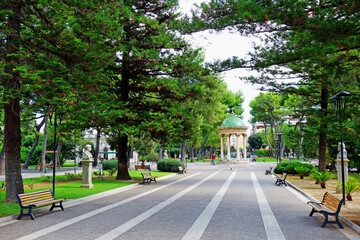 Fototapeta na wymiar A relaxing leafy park with a gazebo and trees in the baroque Southern Italian town of Lecce in the Apulia region of Southern Italy