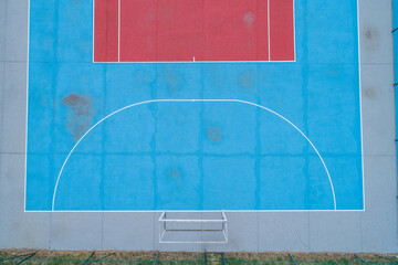aerial view of a futsal court painted red and blue, sports team concept