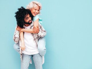 Smiling beautiful woman and her handsome boyfriend. Sexy cheerful multiracial family having tender...